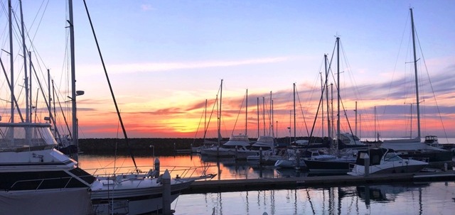 Lets Make Money - photo of boats at sunset